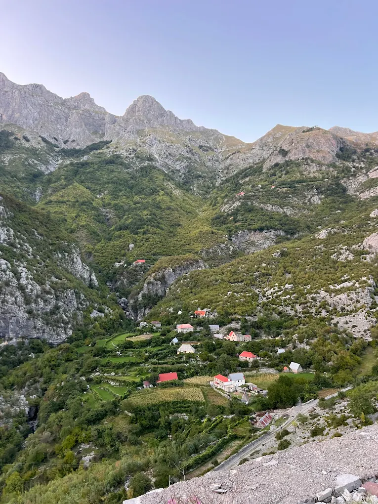Mountain view with small houses and blue sky